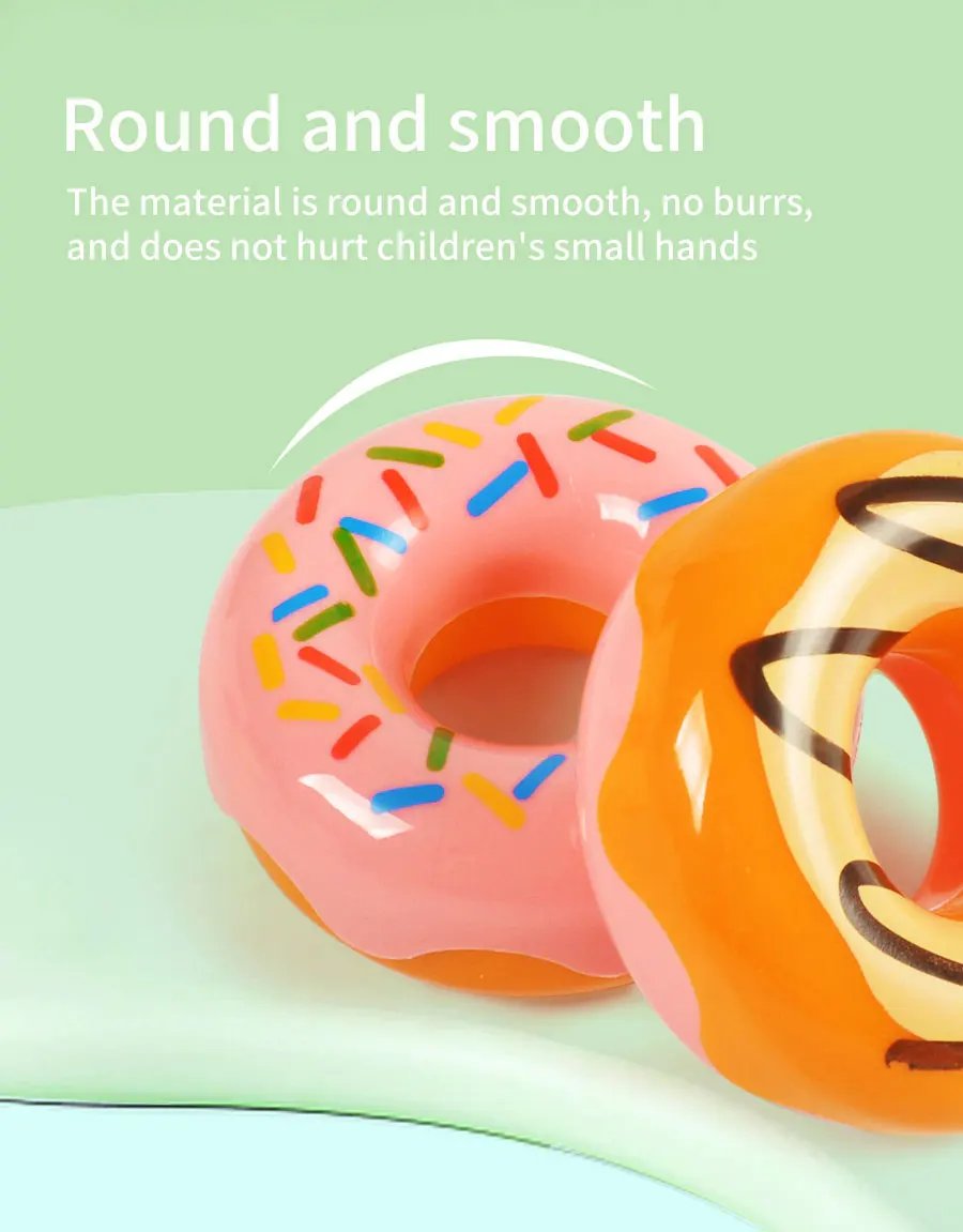 The little girl pretends to play with a picnic basket, tea party set, tea set including coffee machine, cookies, cake, game food